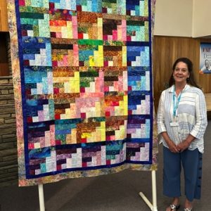 Log Cabin in Batiks by Anne Stafford.